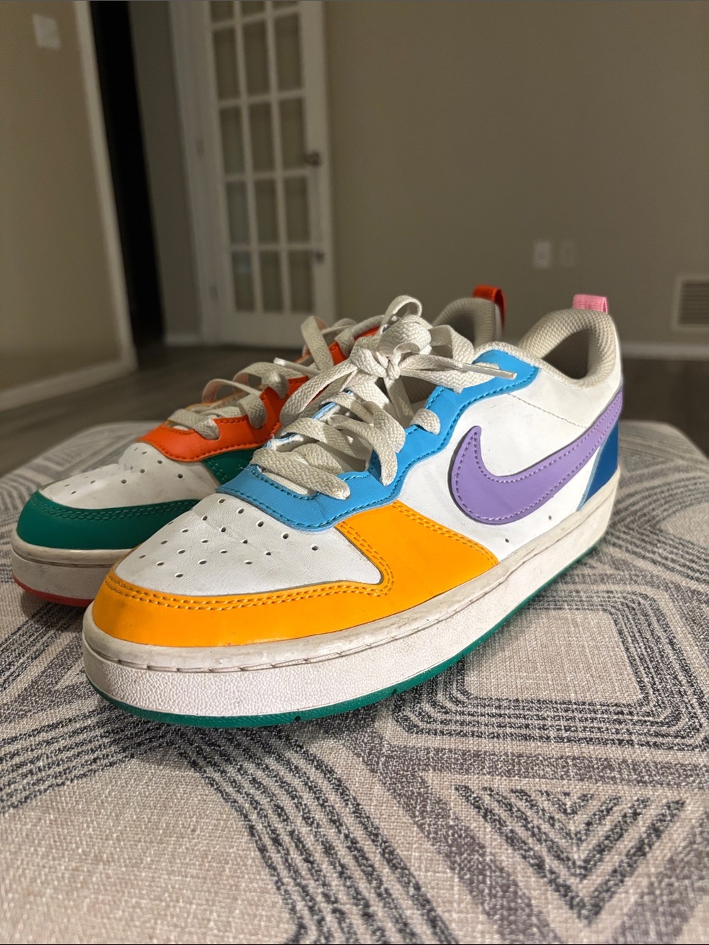 Nike Kids White Sneakers with Orange, Blue, Purple & Green Accents